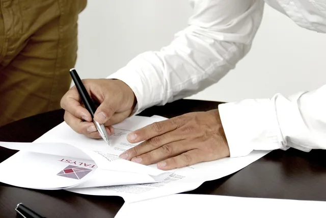 firm, contract, person signing a document, firm, contract, contract, contract, contract, contract. 5 things to check in a UK lead generation agency contract